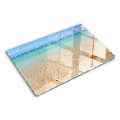 Snijplanken glas Strand met schelpen en golven