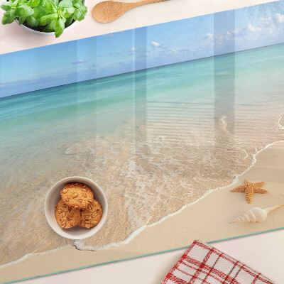 Snijplanken glas Strand met schelpen en golven