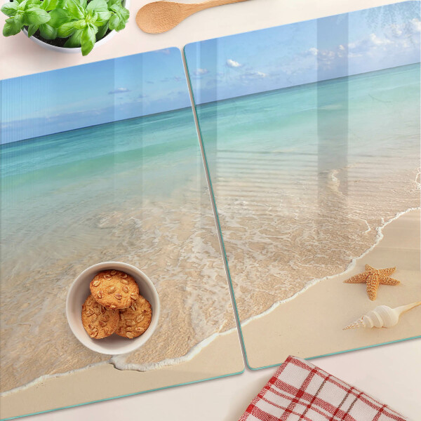 Snijplanken glas Strand met schelpen en golven