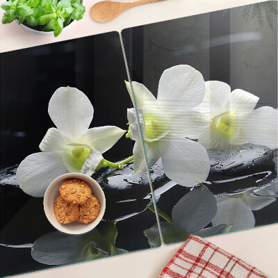 Snijplanken van glas Orchideeën op een zwarte achtergrond