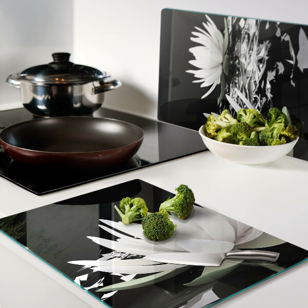 Glazen snijplanken Waterlelies op een zwarte achtergrond