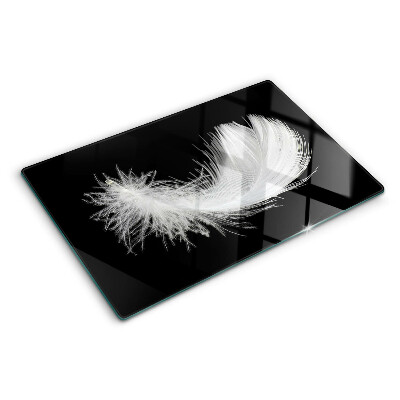 Glazen snijplanken Veer op een zwarte achtergrond