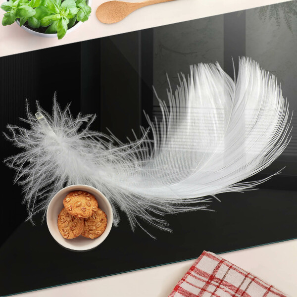 Glazen snijplanken Veer op een zwarte achtergrond