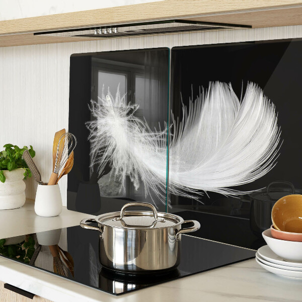 Glazen snijplanken Veer op een zwarte achtergrond