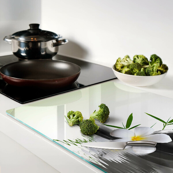 Snijplanken glas Bloemen en stenen op het water