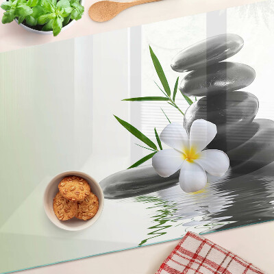 Snijplanken glas Bloemen en stenen op het water