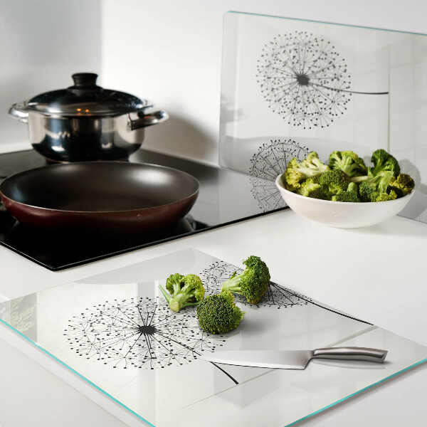 Snijplanken glas Paardenbloemen op een witte achtergrond