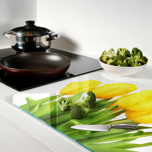 Snijplanken glas Gele tulpen op een groene achtergrond