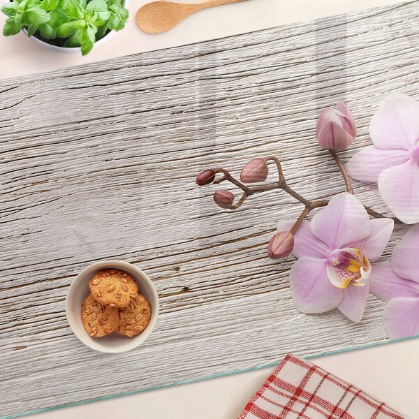 Snijplanken glas Orchideeën op een houten achtergrond