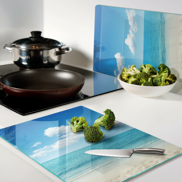 Snijplanken glas Strand met een blauwe lucht