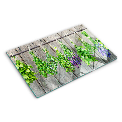 Snijplanken glas Gedroogde kruiden op een houten achtergrond