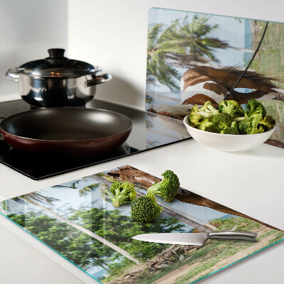 Glazen snijplanken Een paard met palmbomen op de achtergrond.