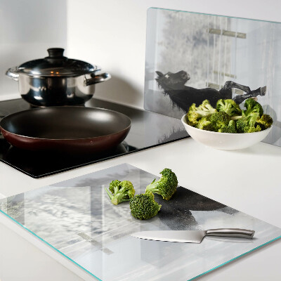 Glazen snijplanken Een paard in een winterlandschap