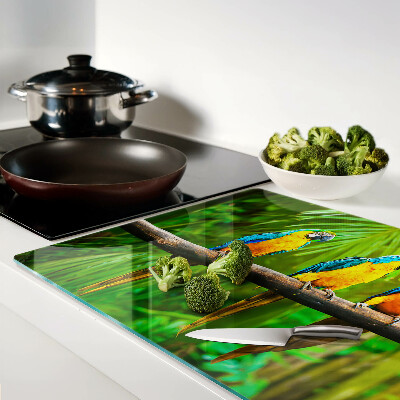 Snijplanken glas Papegaaien op een tak in de tropen