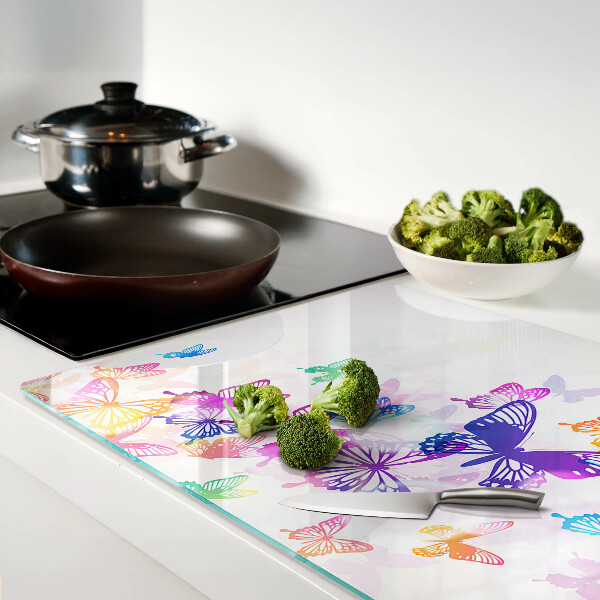 Snijplanken van glas Een motief van kleurrijke vlinders die wegvliegen.