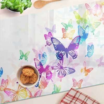 Snijplanken van glas Een motief van kleurrijke vlinders die wegvliegen.