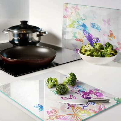 Snijplanken van glas Een motief van kleurrijke vlinders die wegvliegen.