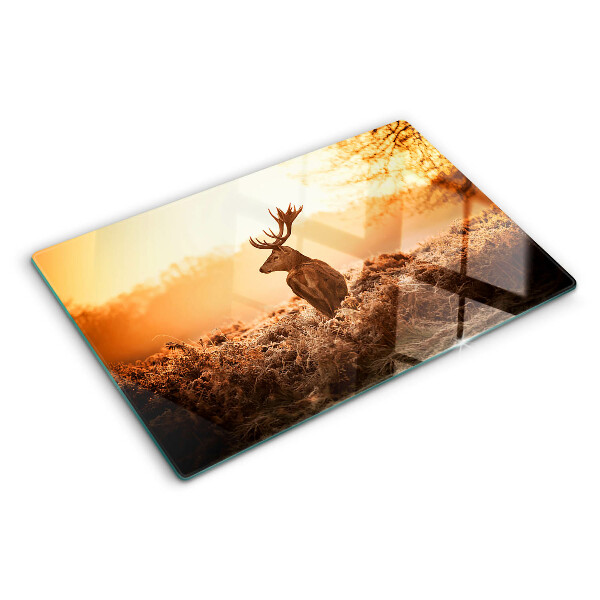 Glazen snijplanken Hert tegen de achtergrond van de zonsondergang