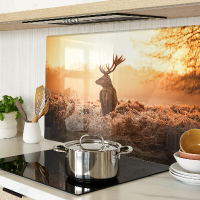 Glazen snijplanken Hert tegen de achtergrond van de zonsondergang