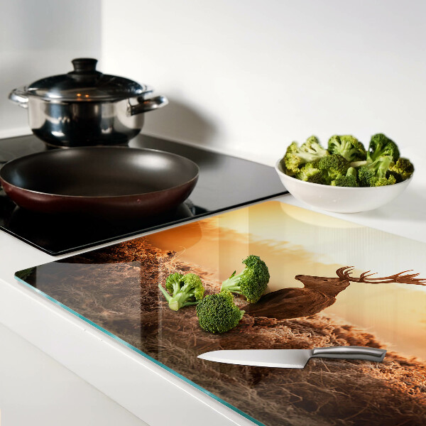 Glazen snijplanken Hert tegen de achtergrond van de zonsondergang