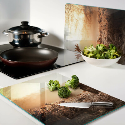 Glazen snijplanken Hert tegen de achtergrond van de zonsondergang