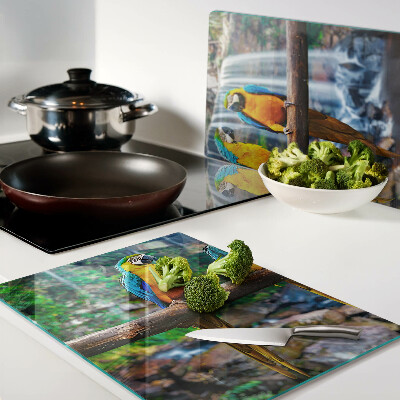 Glazen snijplanken Papegaaien op een tak in een tropisch bos