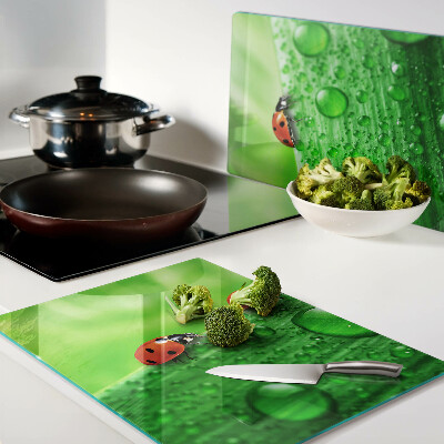 Snijplanken glas Lieveheersbeestjes op een groene achtergrond