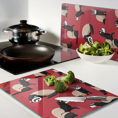 Snijplanken van glas Fretten op een rode achtergrond