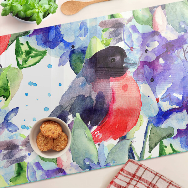 Snijplanken van glas Een vogel tegen een achtergrond van bloemen