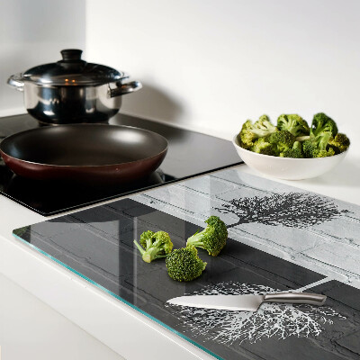 Glazen snijplanken Een boom tegen een achtergrond van bakstenen.