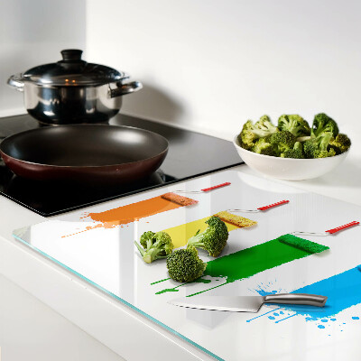 Glazen snijplanken Een regenboog aan verfkleuren in kwasten