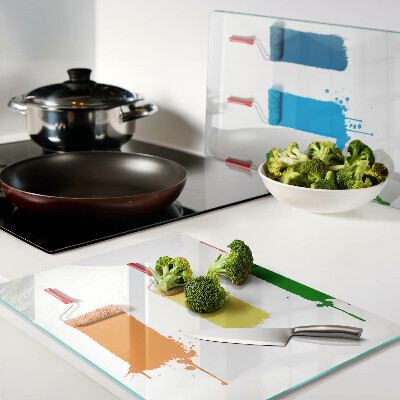 Glazen snijplanken Een regenboog aan verfkleuren in kwasten