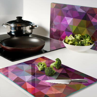 Glazen snijplanken Geometrische vormen in roze en paarse tinten.