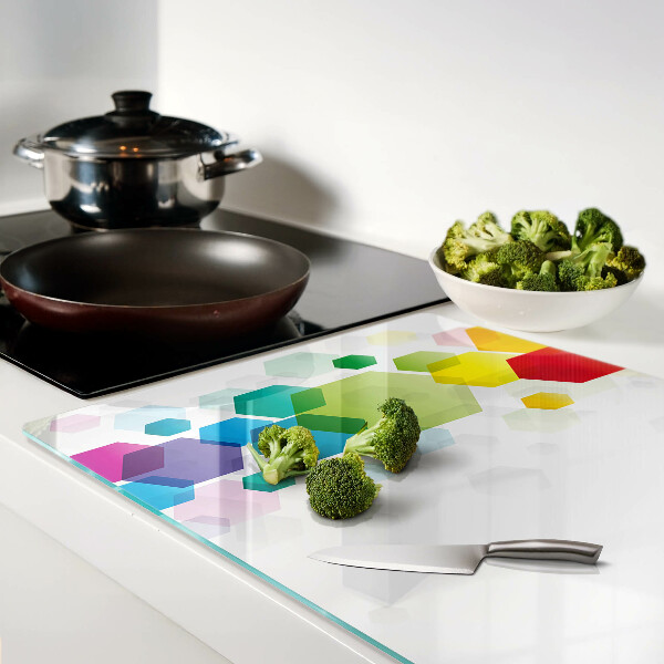 Snijplanken van glas Kleurrijke zeshoeken op de achtergrond