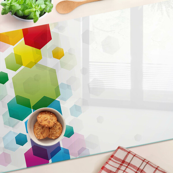 Snijplanken van glas Kleurrijke zeshoeken op de achtergrond