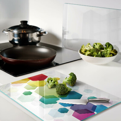 Snijplanken van glas Kleurrijke zeshoeken op de achtergrond