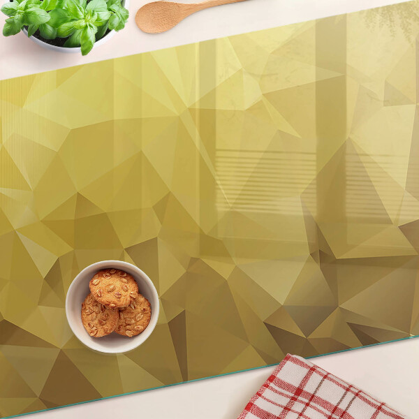 Snijplanken van glas Geometrische vormen in goudtinten
