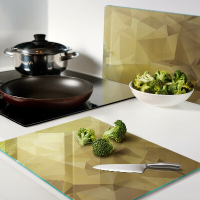 Snijplanken van glas Geometrische vormen in goudtinten