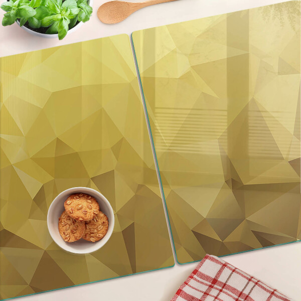Snijplanken van glas Geometrische vormen in goudtinten