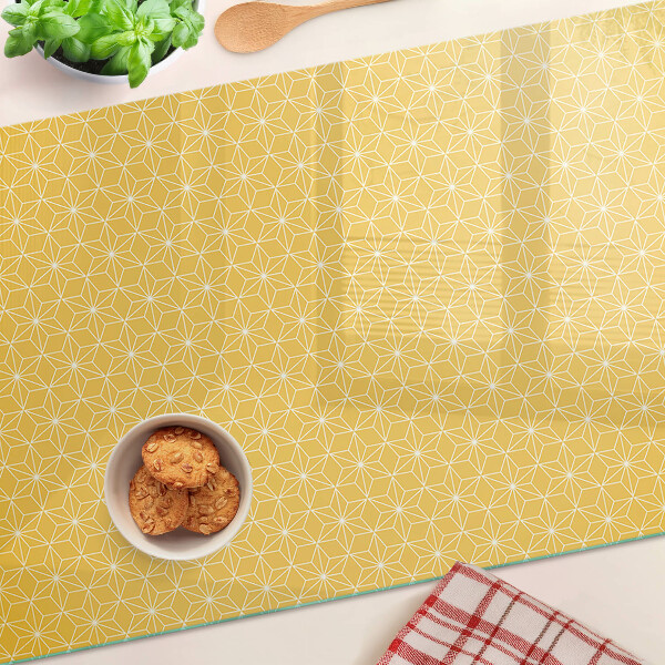 Glazen snijplanken Levensbloem op een gele achtergrond