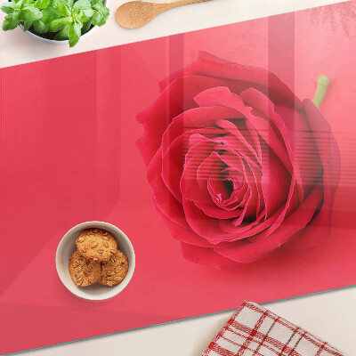 Snijplanken glas Rode roos op de achtergrond