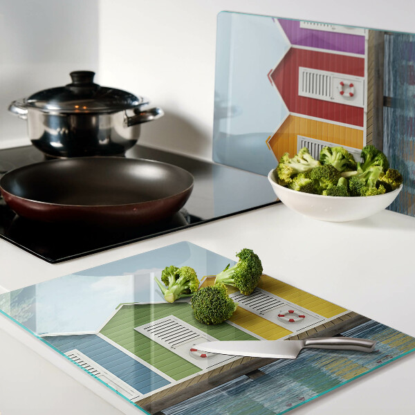 Snijplanken van glas Kleurrijke huizen aan zee