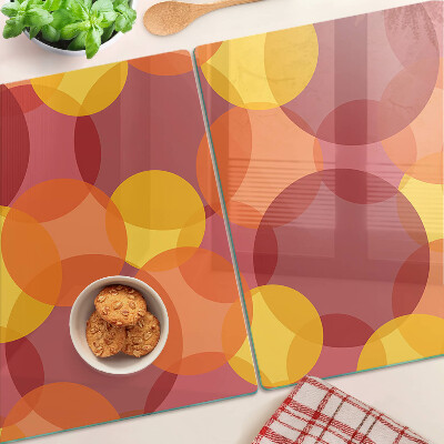 Glazen snijplanken Kleurrijke cirkels in warme tinten.