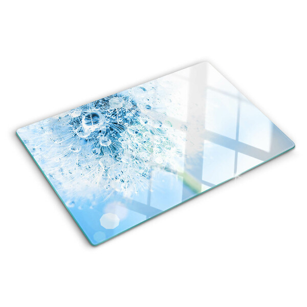 Snijplanken van glas Paardenbloem met waterdruppels