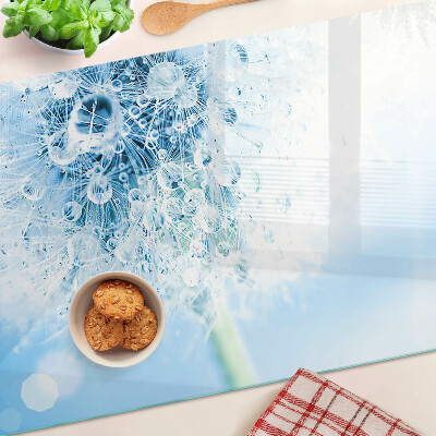 Snijplanken van glas Paardenbloem met waterdruppels