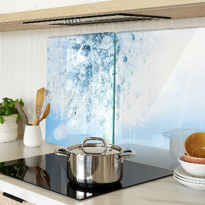 Snijplanken van glas Paardenbloem met waterdruppels