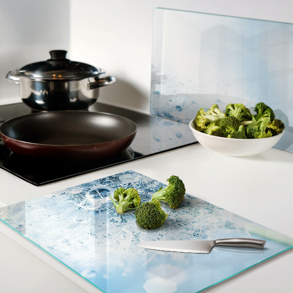 Snijplanken van glas Paardenbloem met waterdruppels