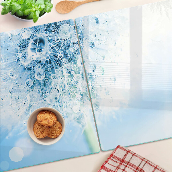 Snijplanken van glas Paardenbloem met waterdruppels