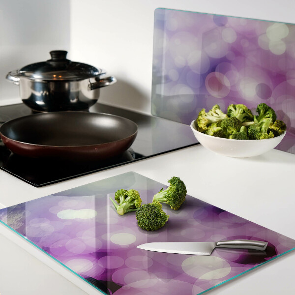 Snijplanken van glas Bokeh in paarse en roze tinten.