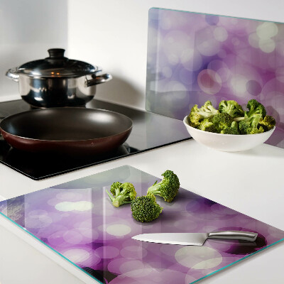 Snijplanken van glas Bokeh in paarse en roze tinten.